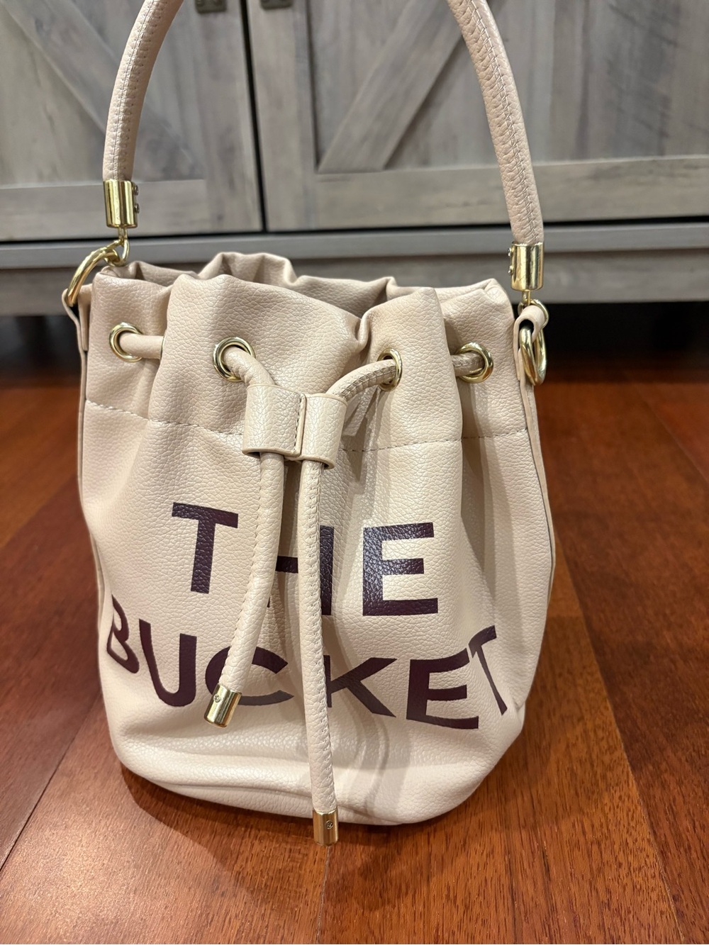 Cream Drawstring Bucket Bag with Gold Hardware